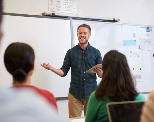 Male teacher at front of class
